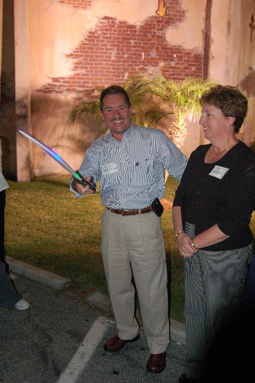 Chuck Schue wielding a sword